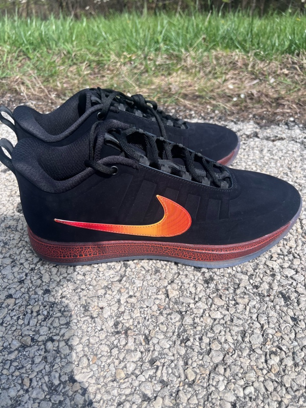 Nike Men’s Black Sneakers with Orange Gradient Swoosh